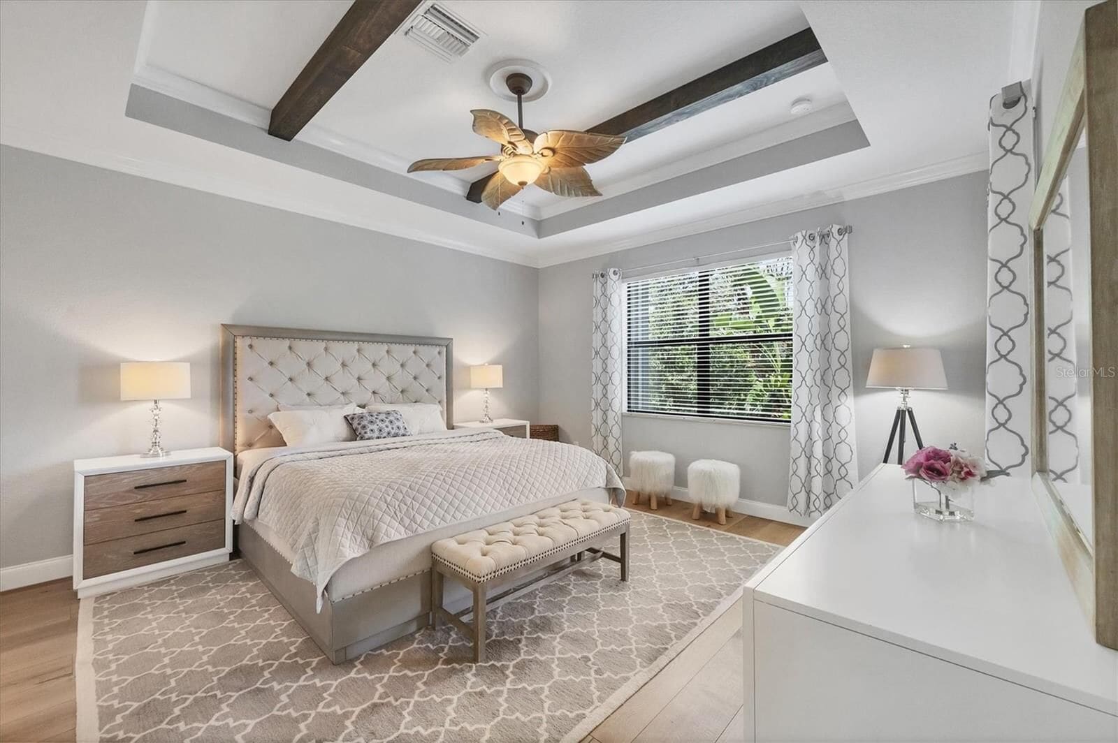 Bedroom with blinds and a ceiling fan