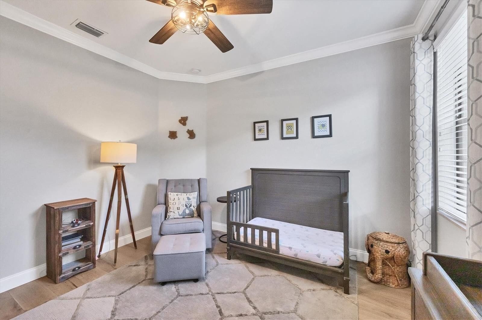 Crib, armchair and bookshelf