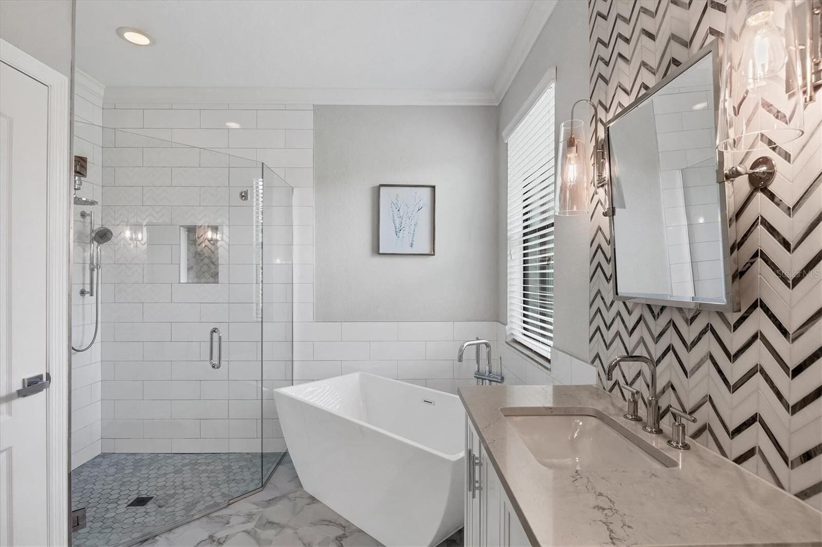 Main bathroom with freestanding tub and glass shower
