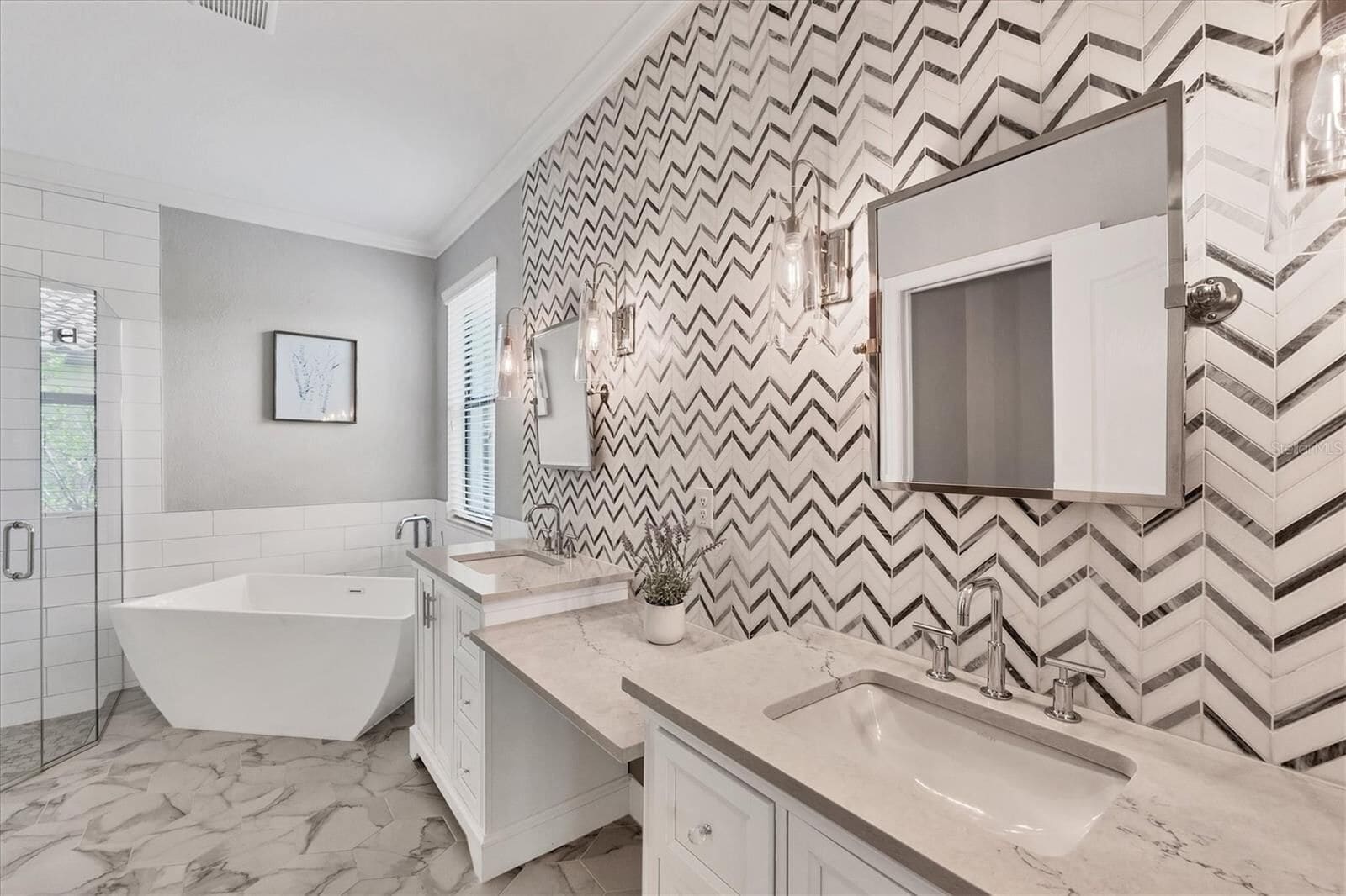 Bathroom with a large bathtub and double sink vanity