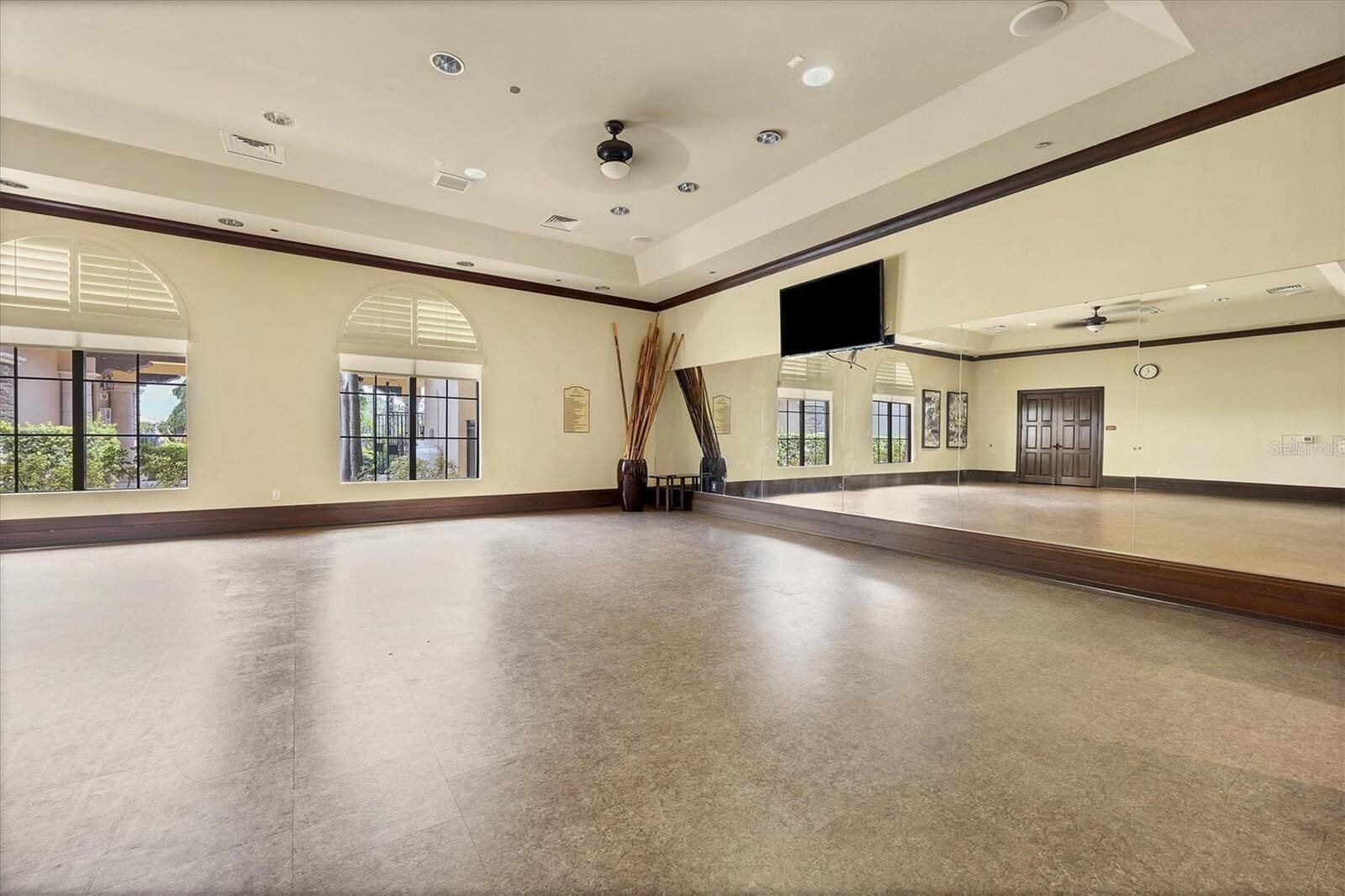 Bonus room with a mirrored wall and TV