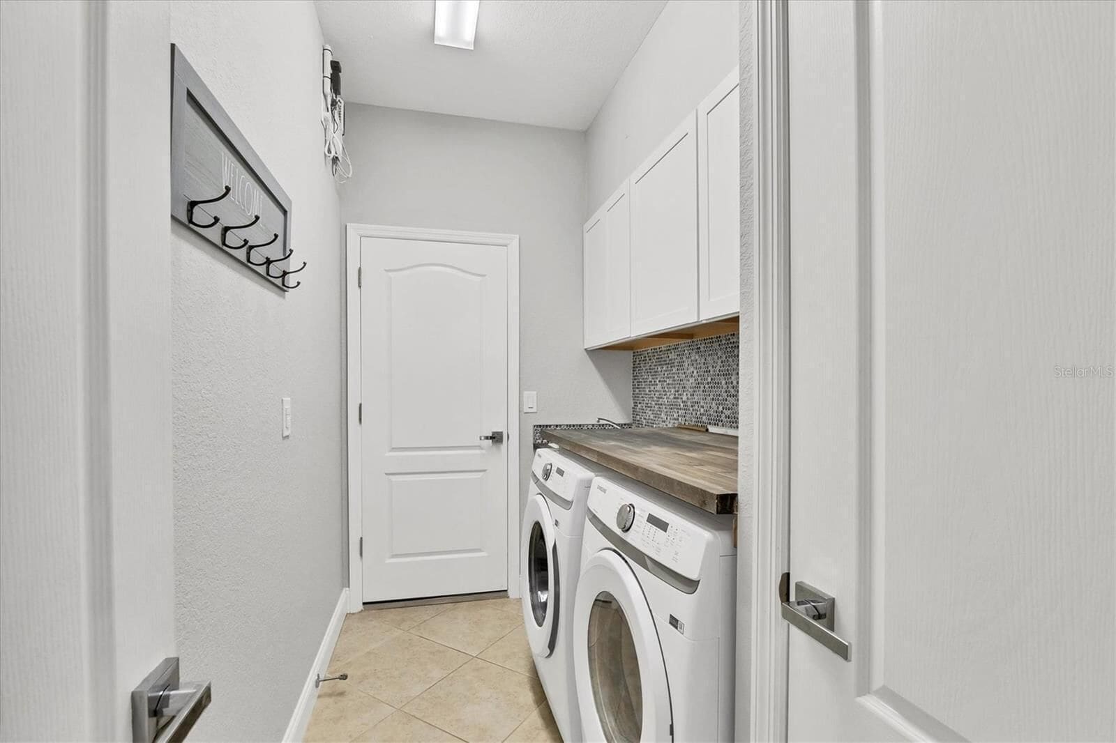 Laundry room with washing machine and dryer