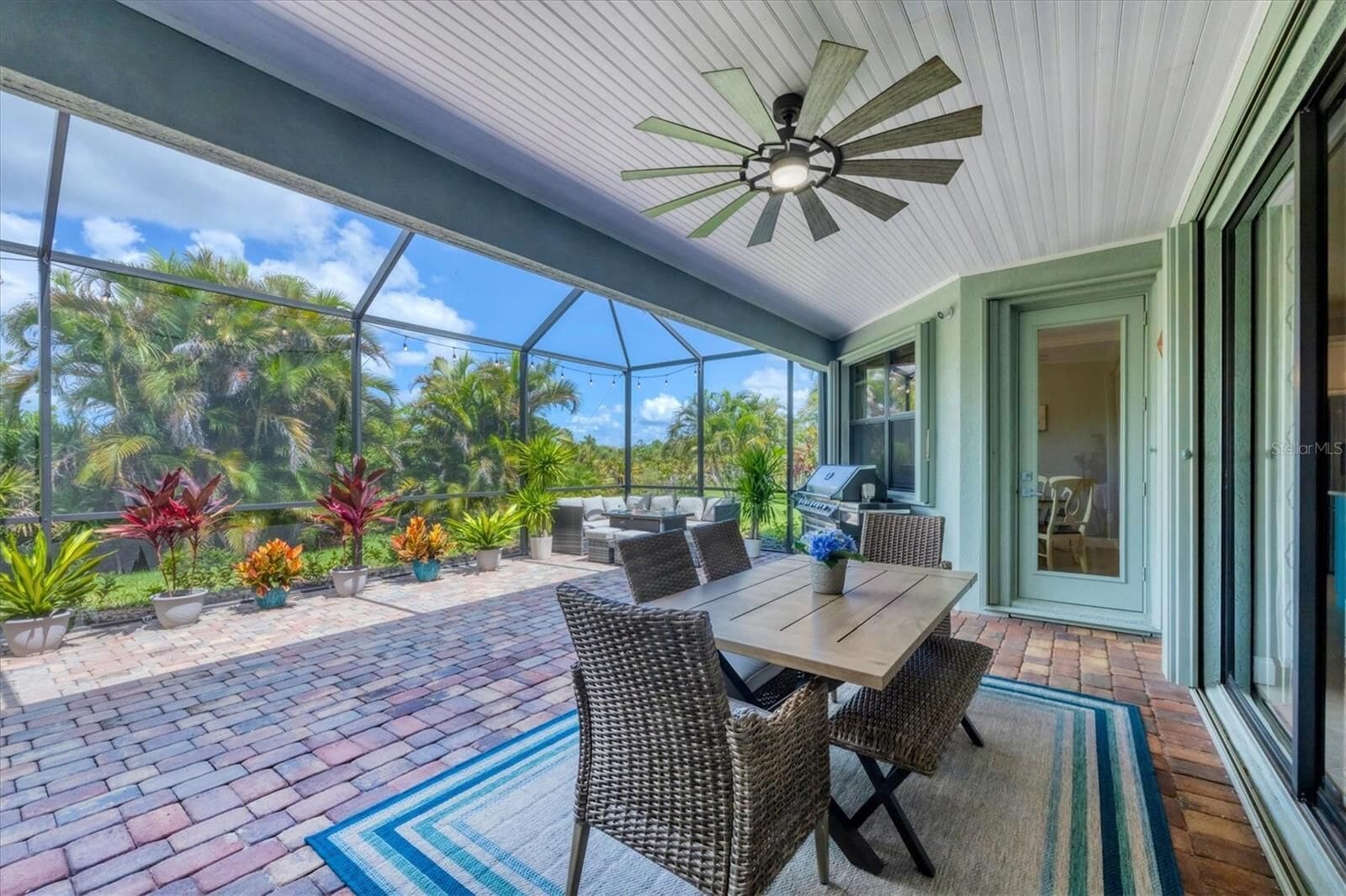 Lanai table and chairs with the ceiling fan