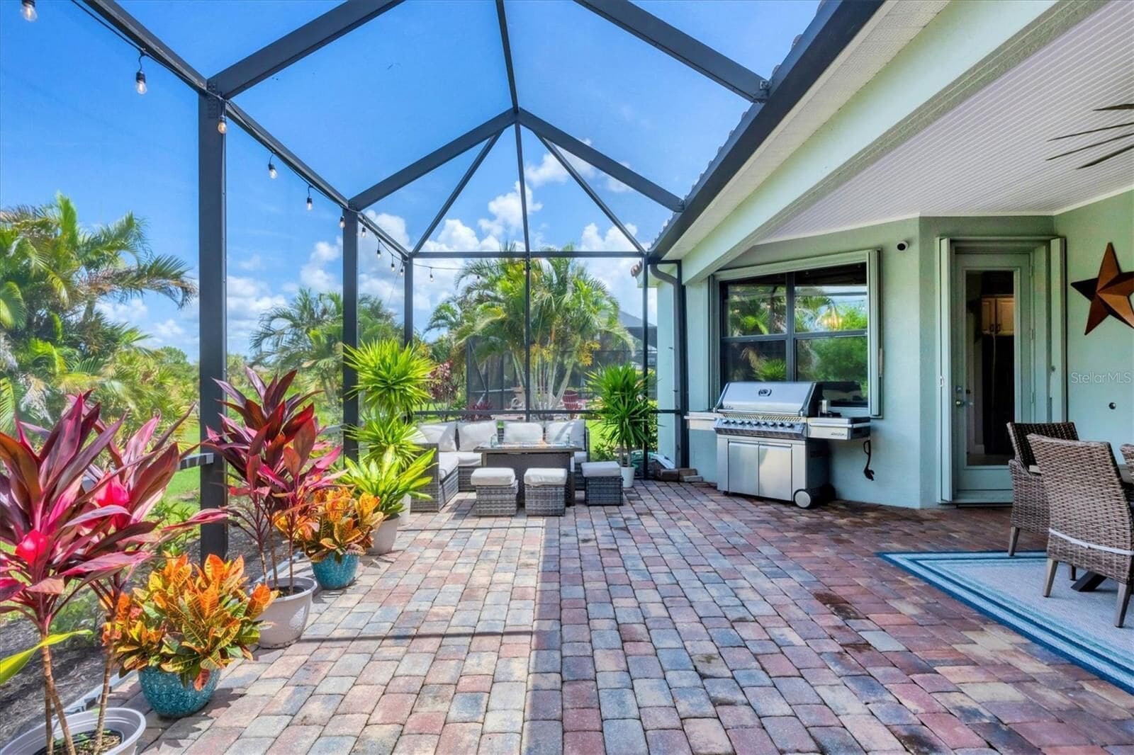 Grill and outdoor furniture on the lanai