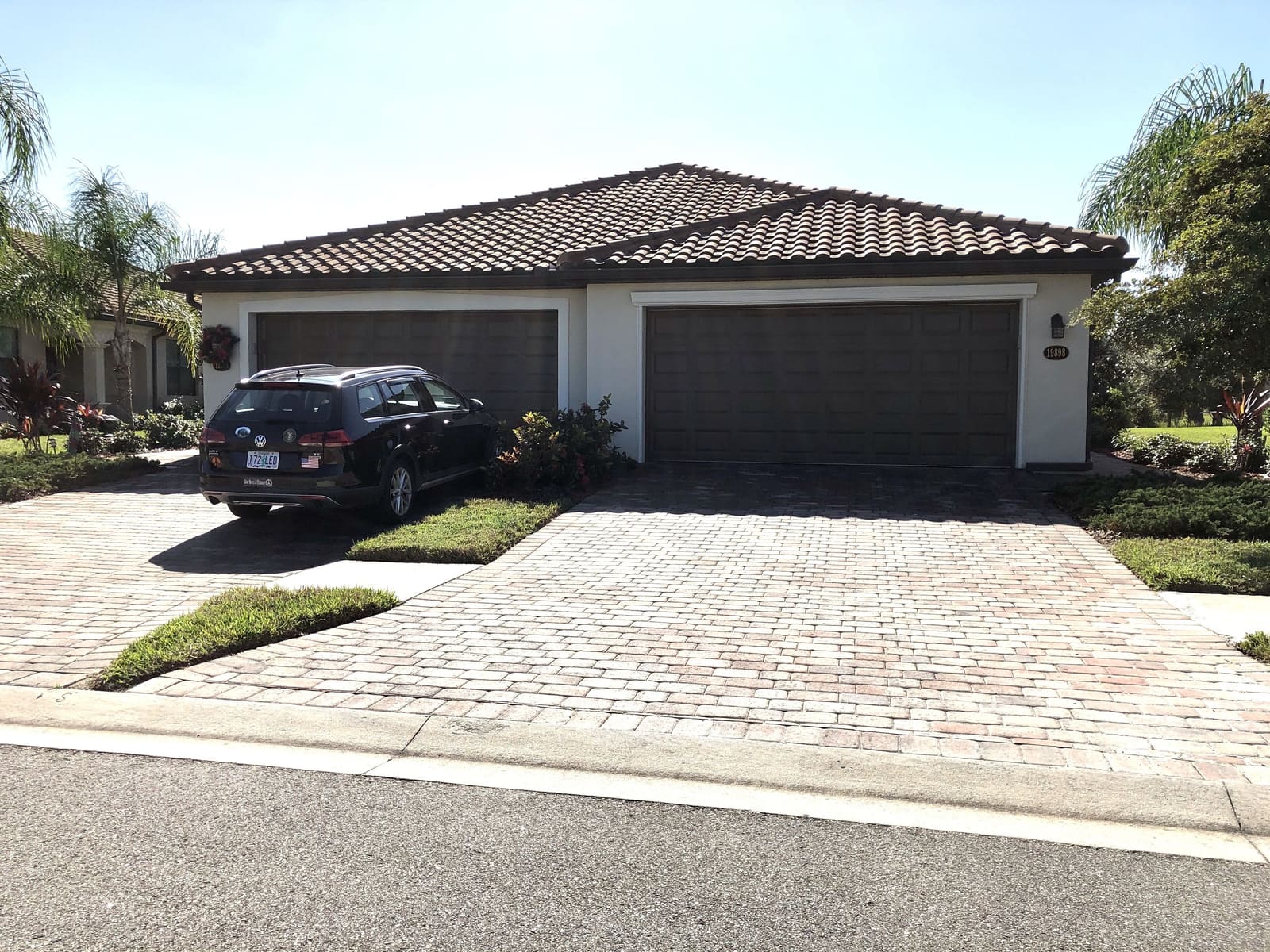 The Villa's tiled roof, garage and driveway