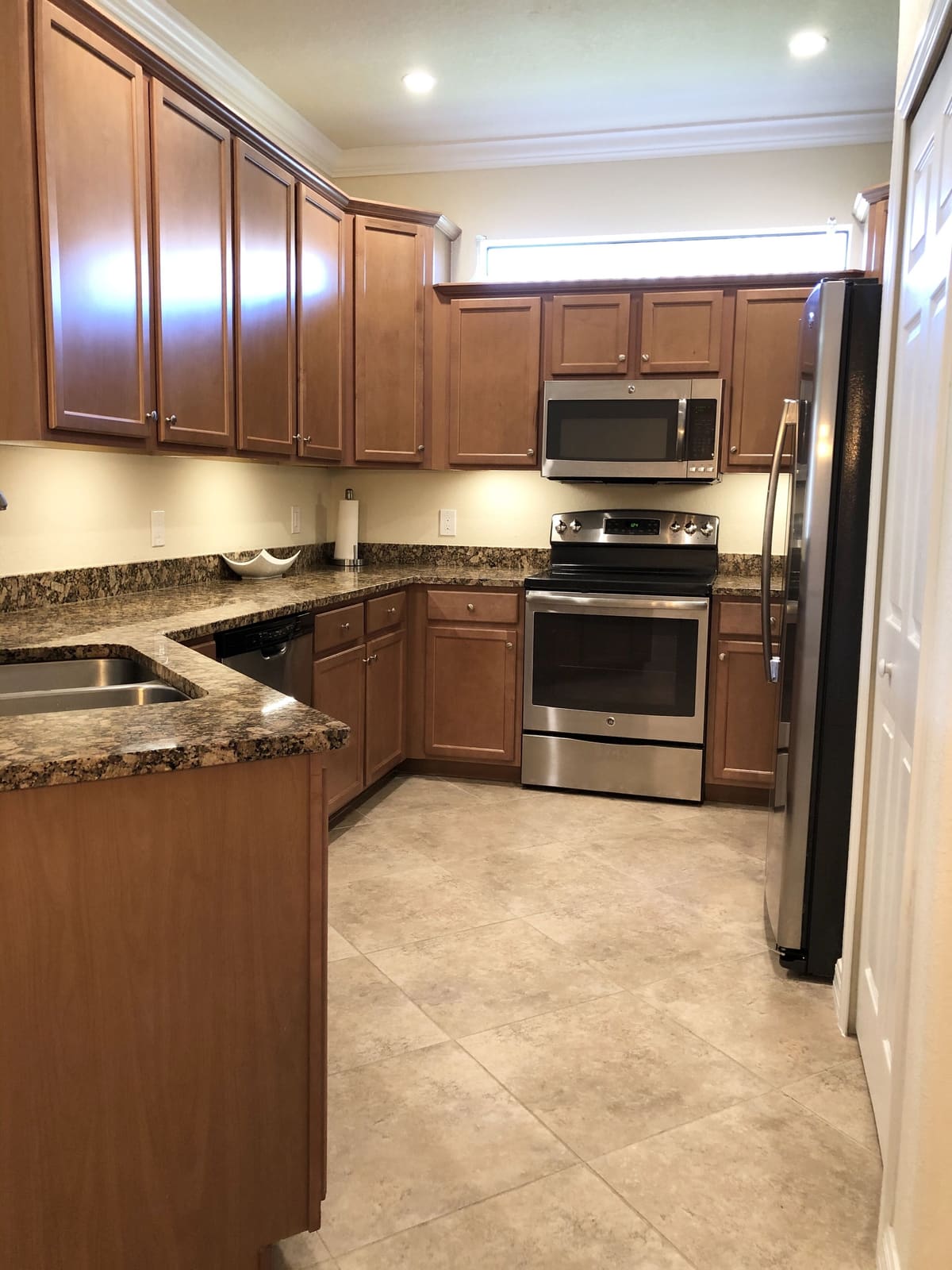 Kitchen with wooden cabinets and stainless appliances
