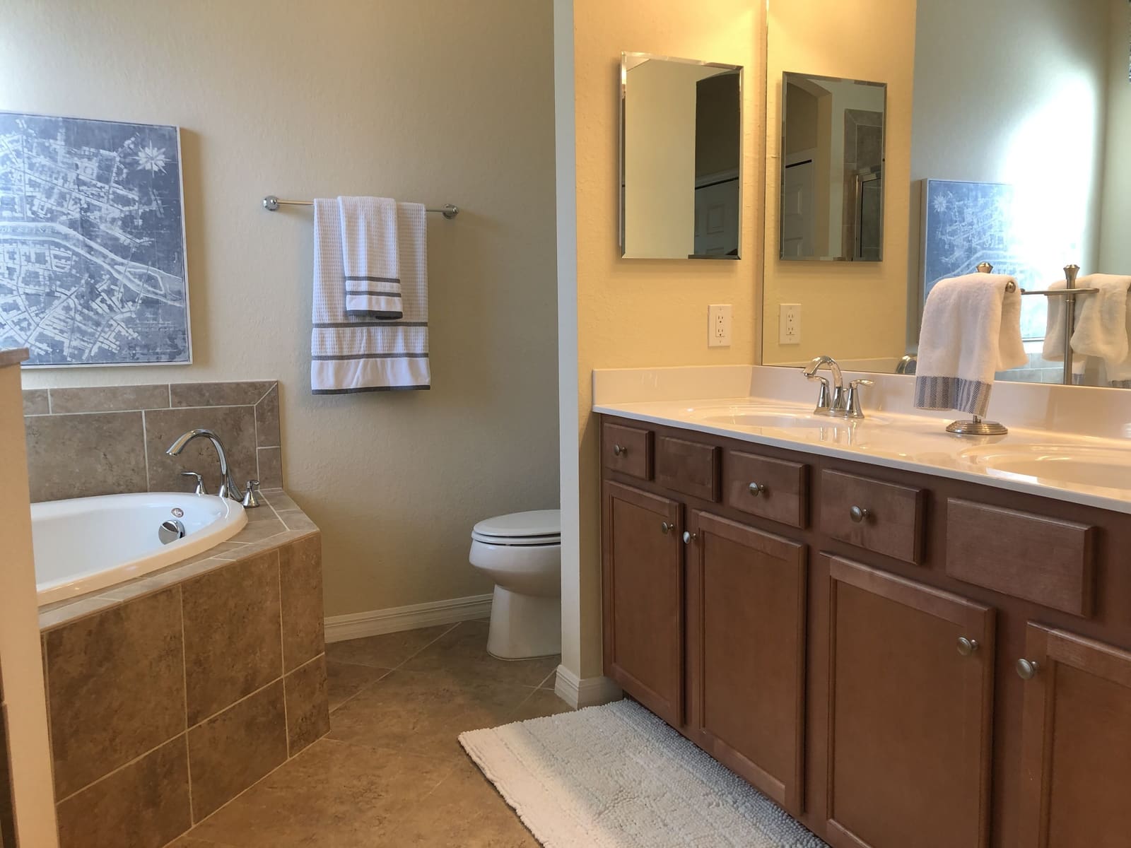 Second bathroom with bathtub, sink and heated towel rail