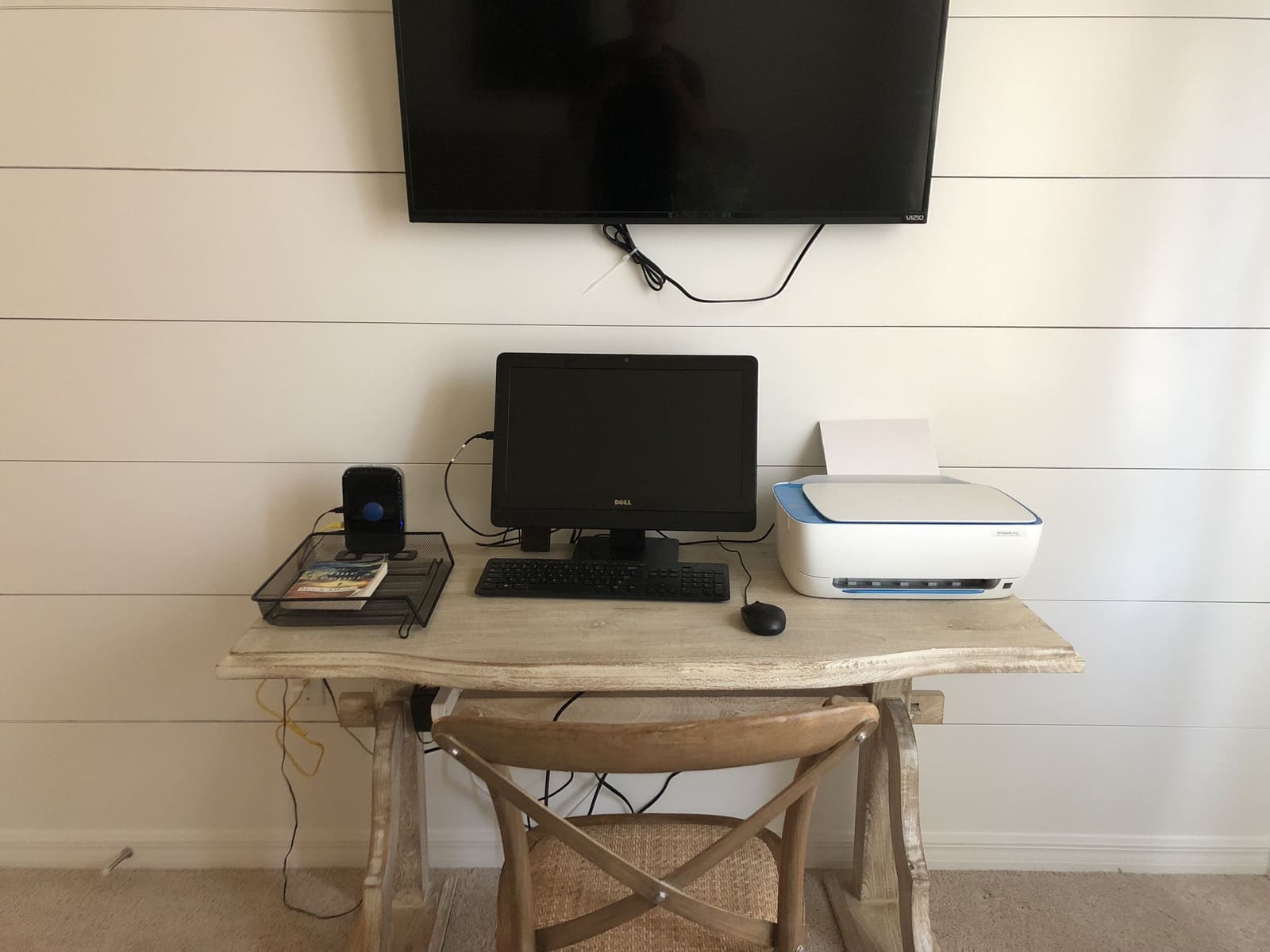 Desk set up for working, with monitor and printer