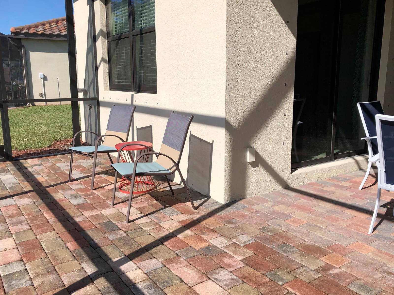 Brick-floored patio with a bistro table