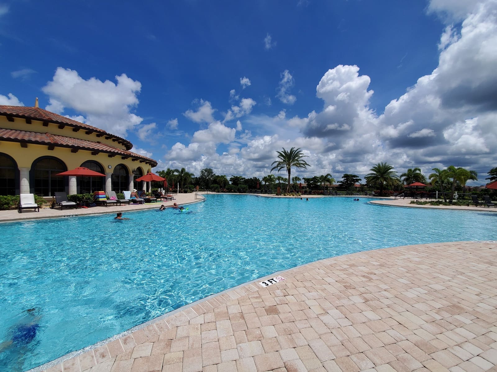 The community resort pool and deck (shared, not private)
